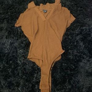 Brown body suit